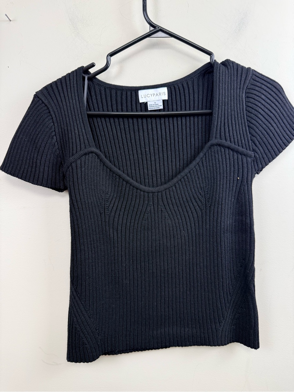 Lucy Paris black ribbed sweetheart neckline short sleeve sweater top.